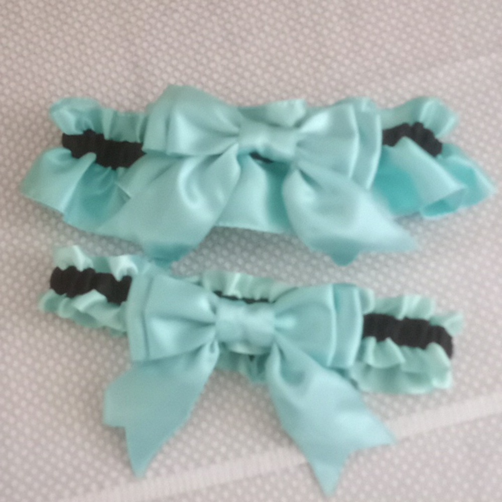 Turquoise and black wedding garter set. One toss garter and one keepsake garter.